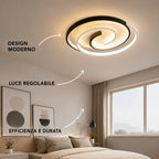 Novoora modern spiral LED ceiling light with adjustable brightness, mounted in a minimalist bedroom interior.